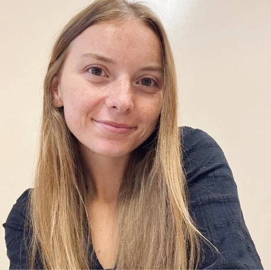 payton roberts Happy mother scheduling child's psychological assessment on phone at home.